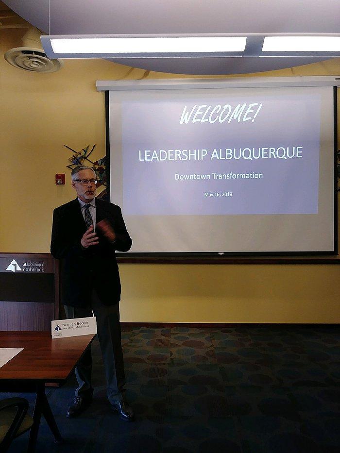  New Mexico Mutual CEO Norm Becker addresses the Leadership Albuquerque class, outlining the CHamber's multi-pronged efforts in improving Downtown Albuquerque