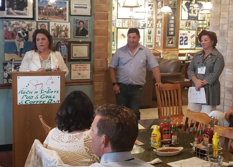  State Representative Patty Lundstrom and State Senator George Muñoz, both from the Gallup area, speak to the New Mexico Roadrunners group as Dr. Cheryl Willman from the UNM Comprehensive Cancer Center and Chair of the Chamber's NM Roadrunner initiative looks on